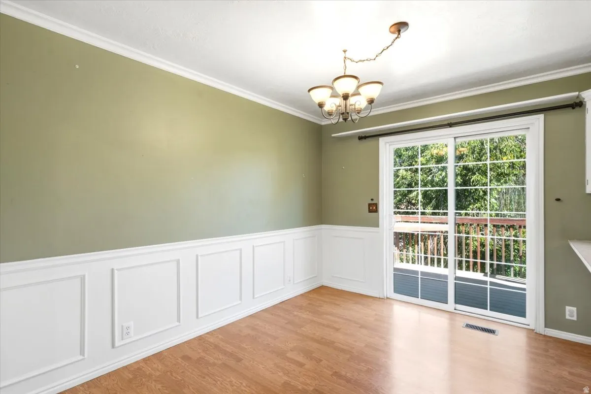 Wood-finish flooring with wainscoting and crown molding