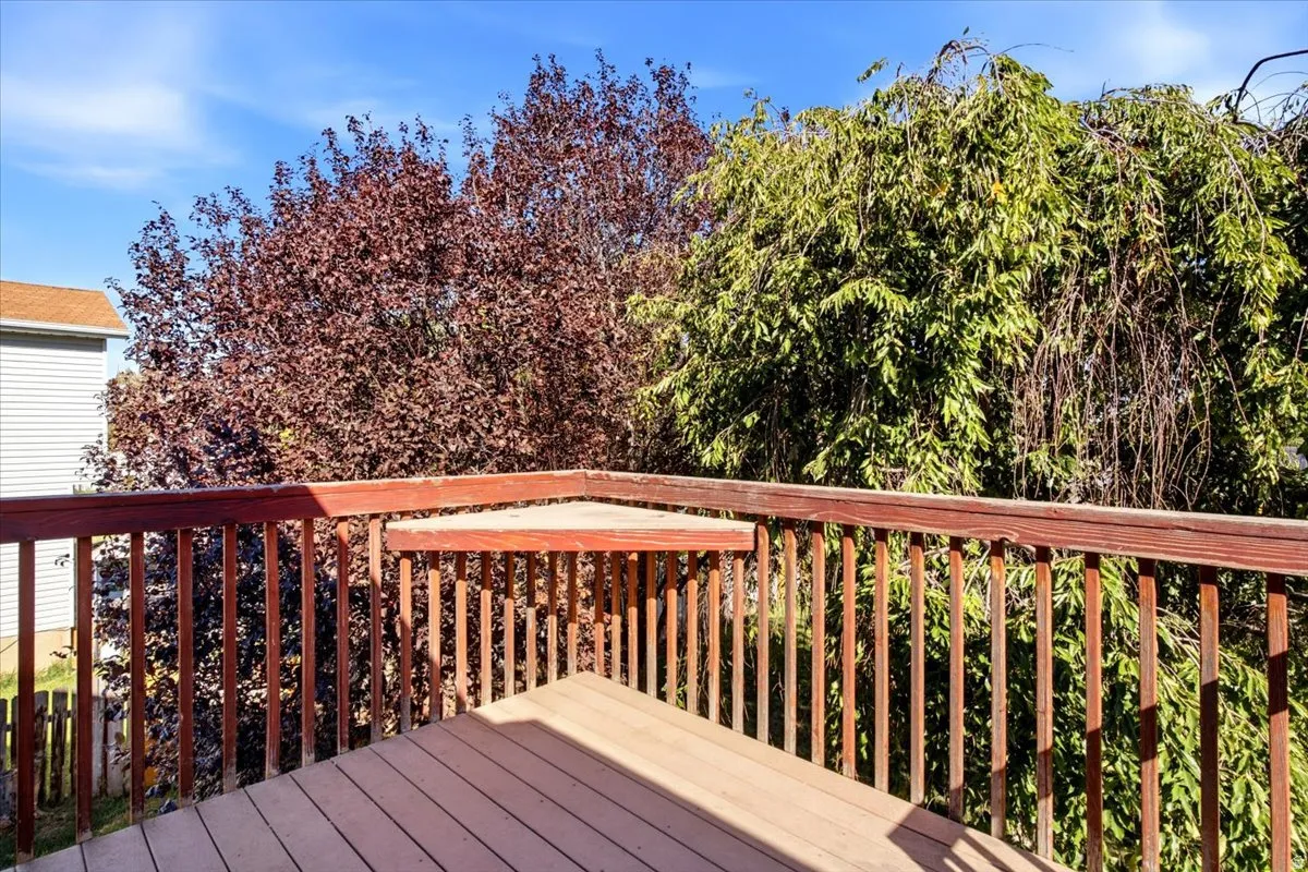 Deck featuring wood-finish railing and composite decking