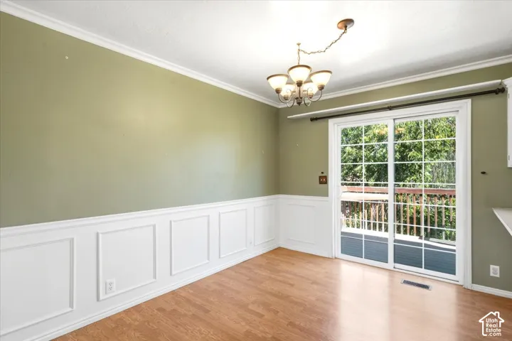 Wood-finish flooring with wainscoting and crown molding