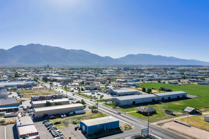 Expansive mountain range backdrop and clear blue sky