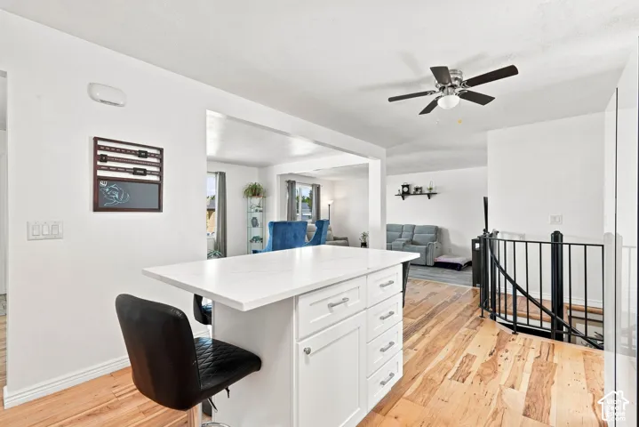 White kitchen island with a light-toned countertop