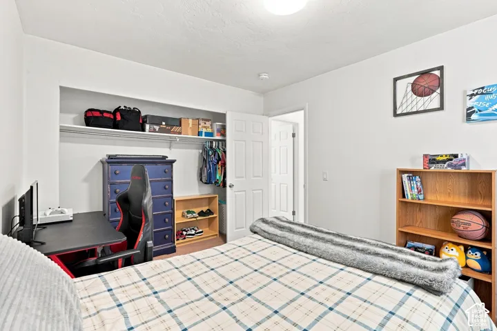 Recessed closet with shelving and hanging rod