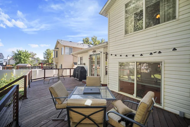 Expansive outdoor deck with wood flooring and contemporary railing