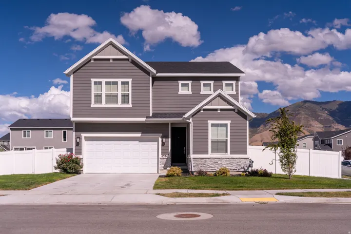 Gray horizontal siding exterior with white trim accents