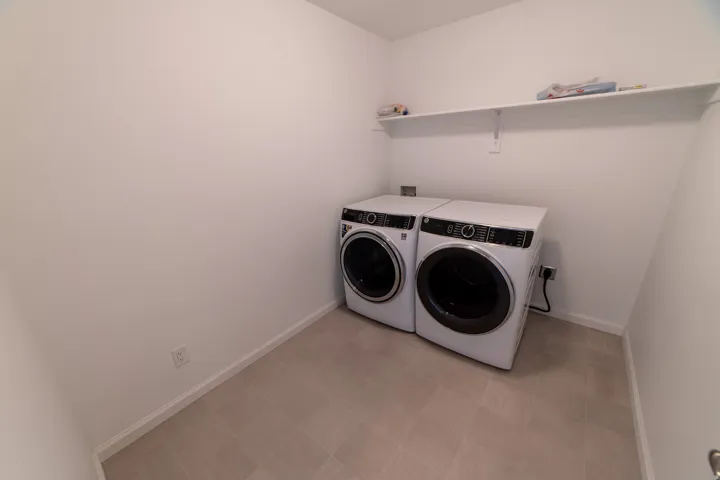 Built-in shelving for storage above side-by-side laundry appliances