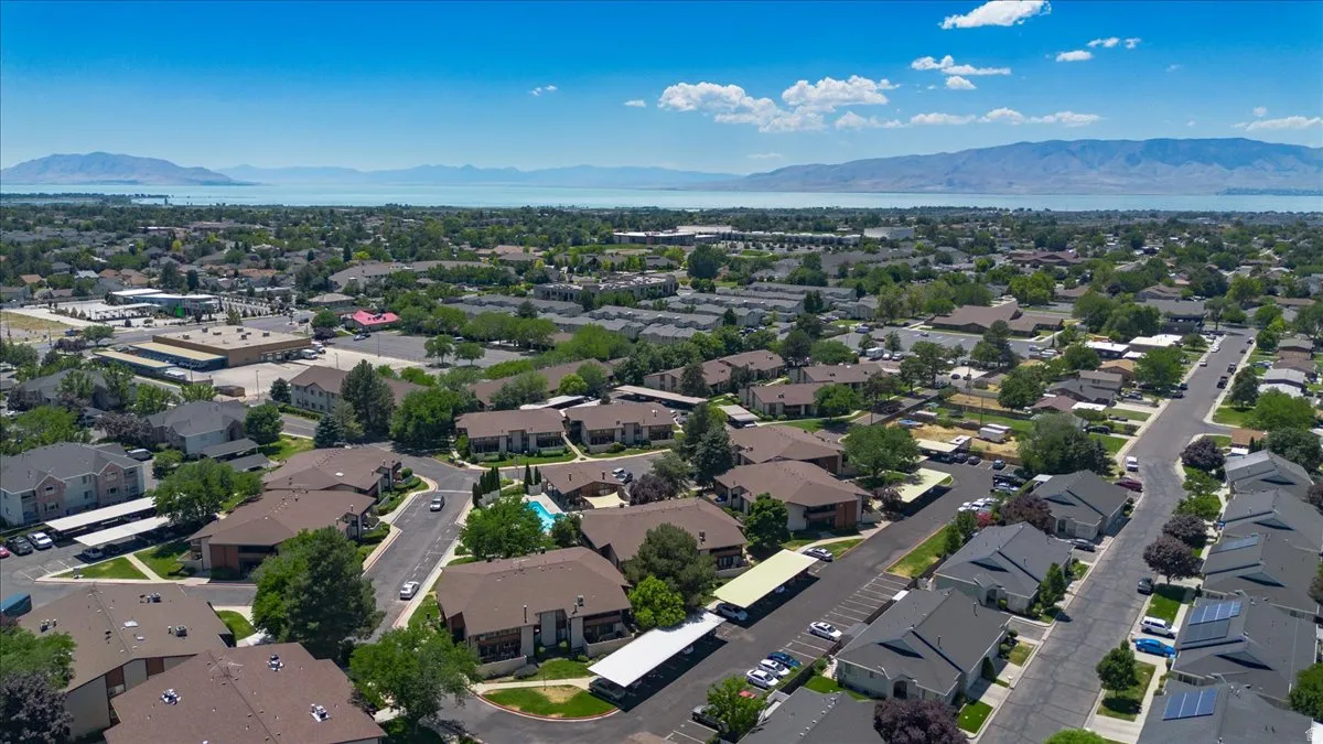 Expansive neighborhood setting with a prominent body of water and distant mountains