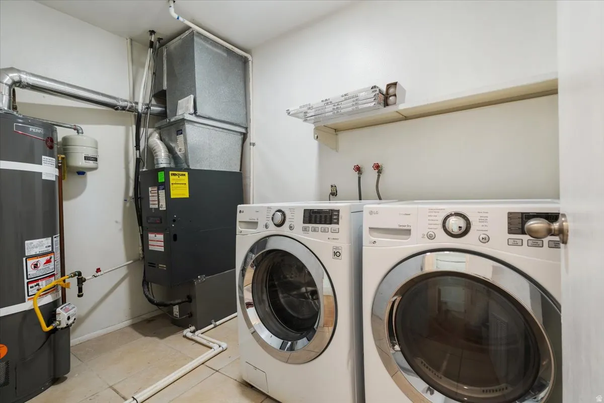 Dedicated utility space featuring a water heater, furnace, and wall-mounted shelving