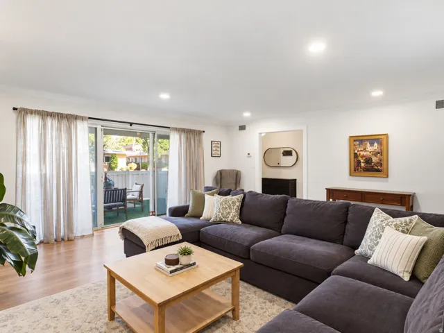Recessed lighting, wood-finish flooring, sliding glass doors, and a private outdoor patio