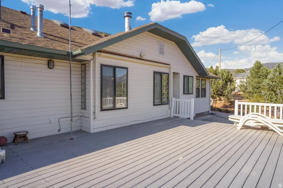 Expansive exterior deck with a light-toned surface