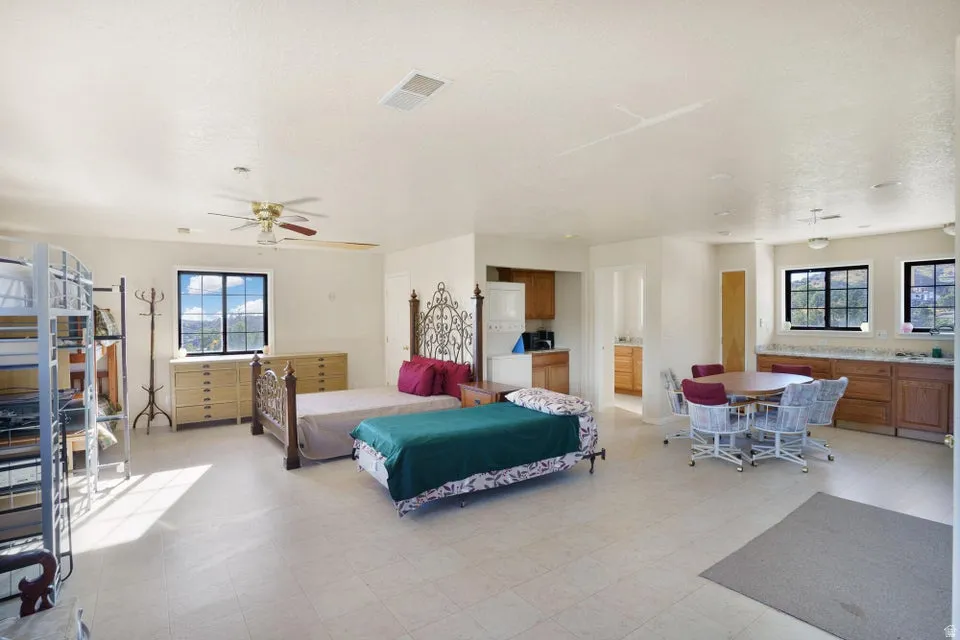 Spacious room with tile flooring and multiple windows