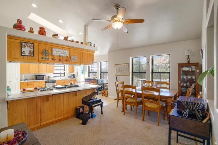 Kitchen island with light-toned wood paneling and a light-colored countertop