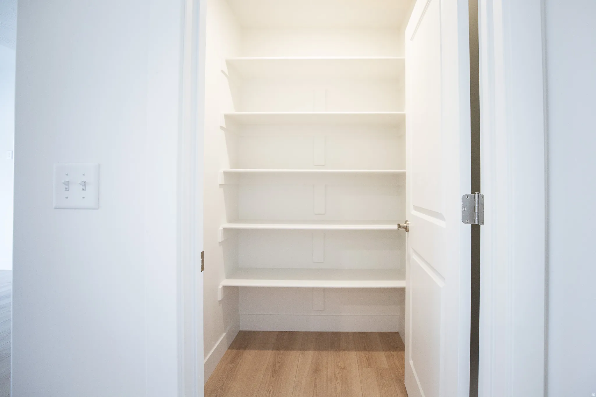 Walk-in pantry adjacent to kitchen.