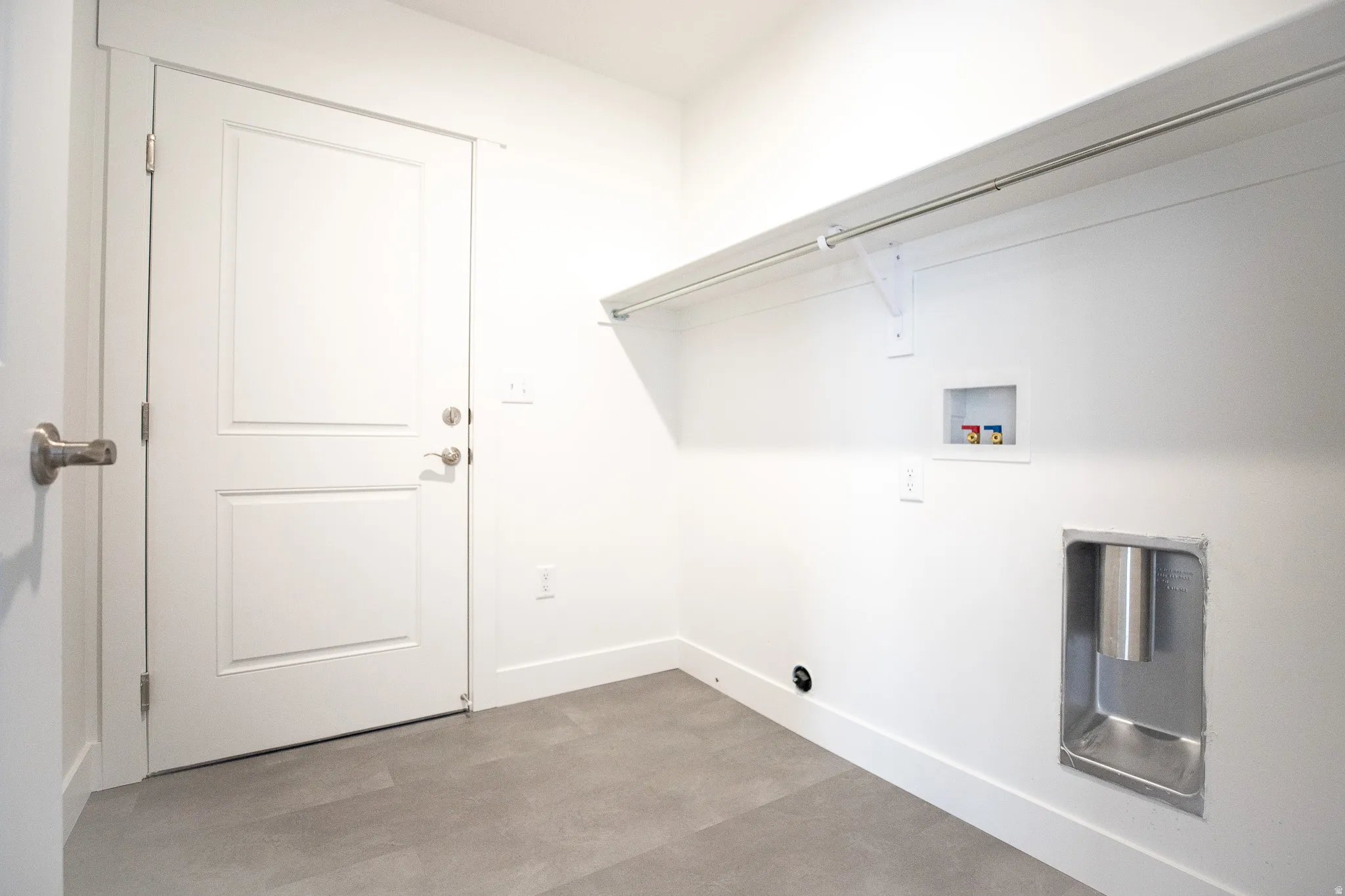 Full-size, dedicated laundry room with door to garage and washer/dryer hookups.
