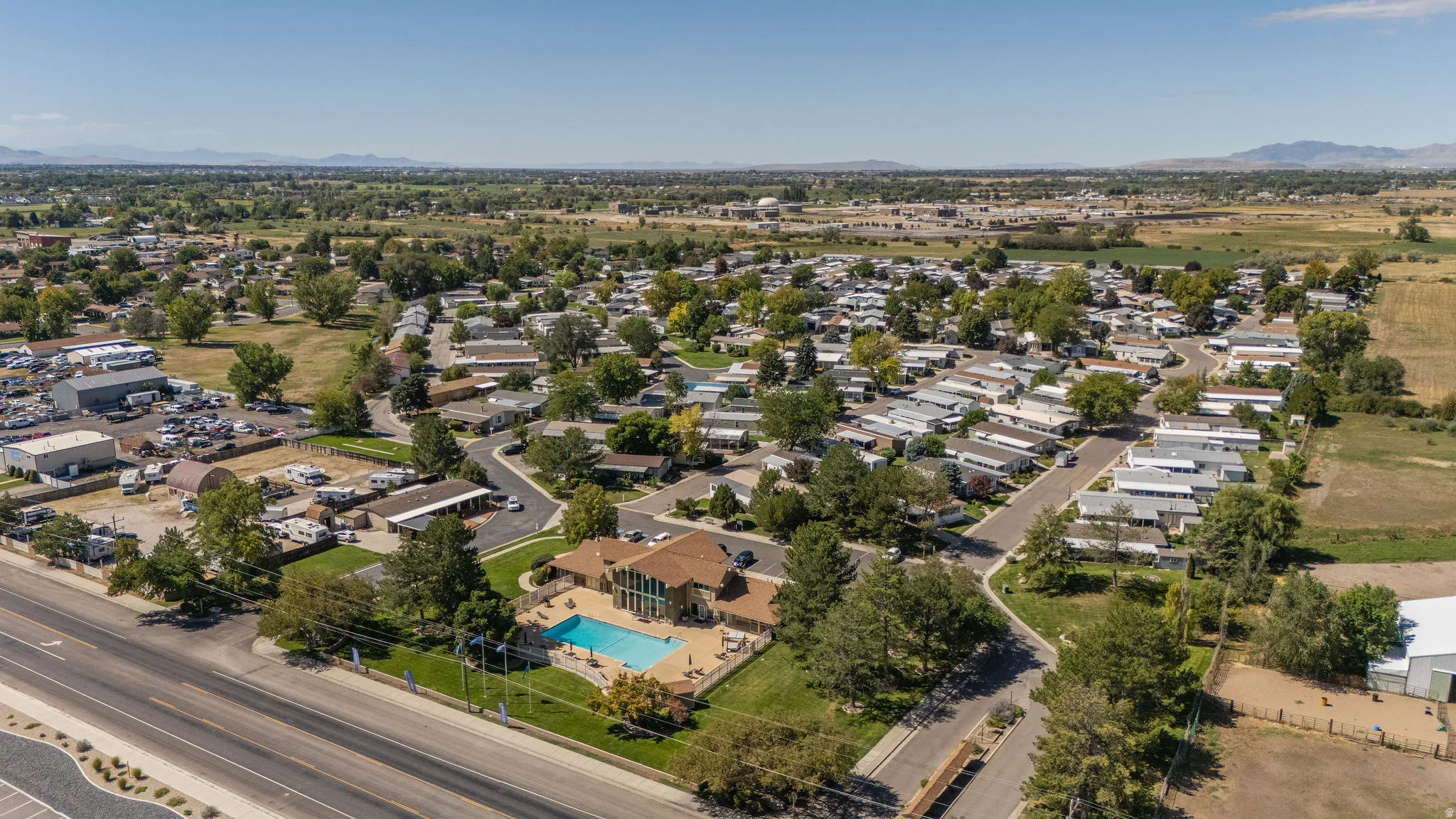 Community features a residential area, a recreational building, and an outdoor swimming pool with a surrounding hardscaping