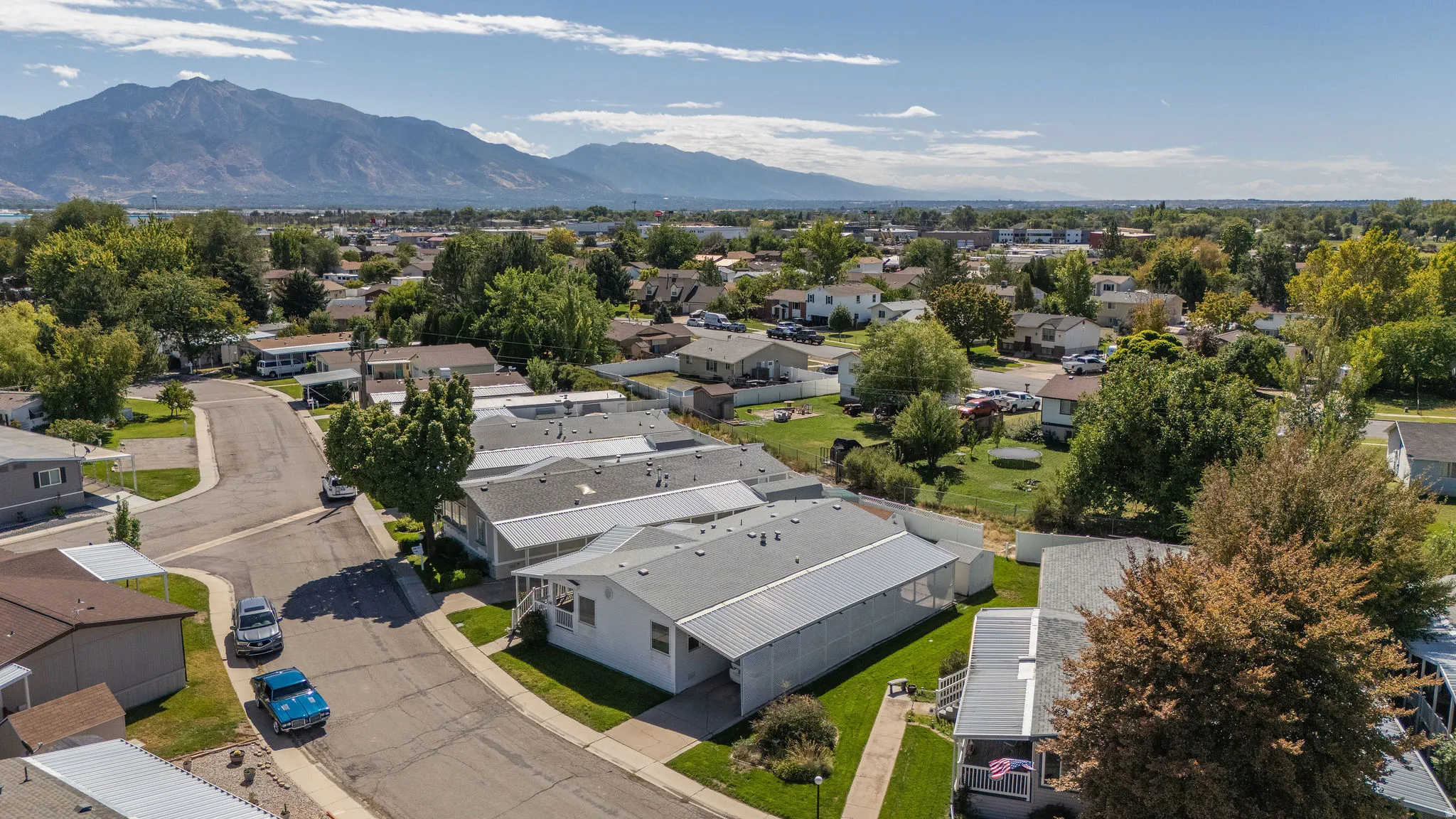 Residential community with mature landscaping and distant mountain scenery