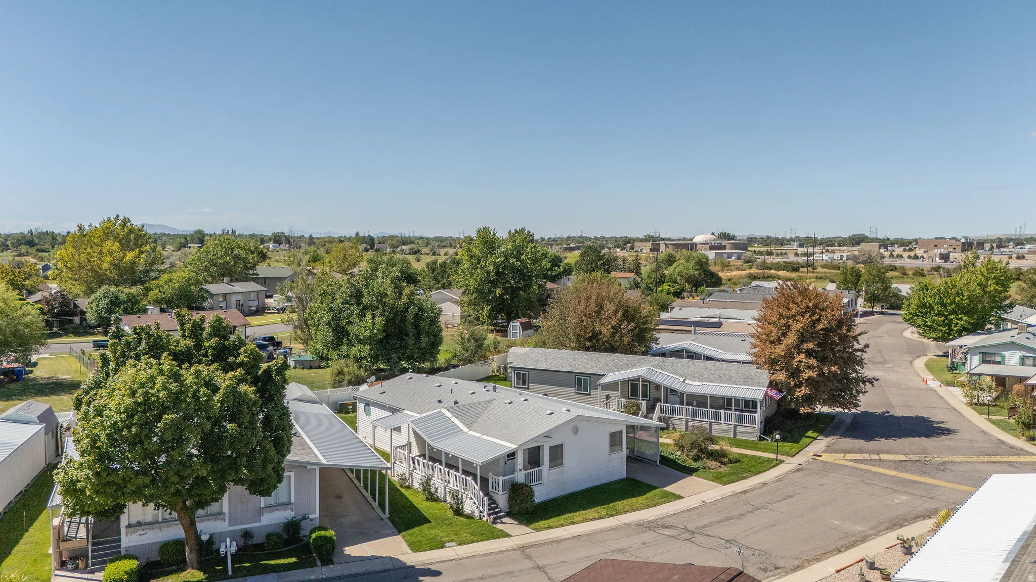 Residential area with paved streets and established landscaping