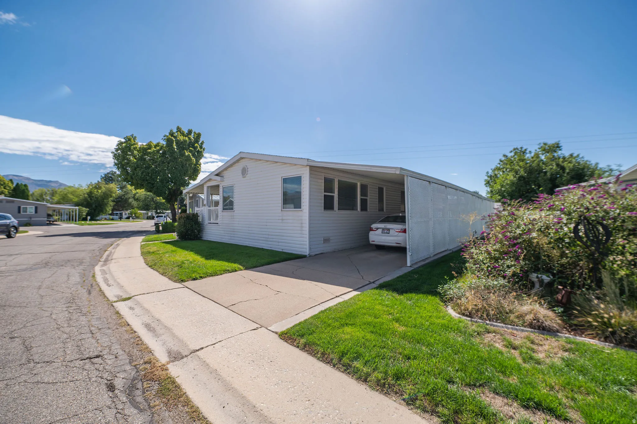 White exterior siding with a covered carport