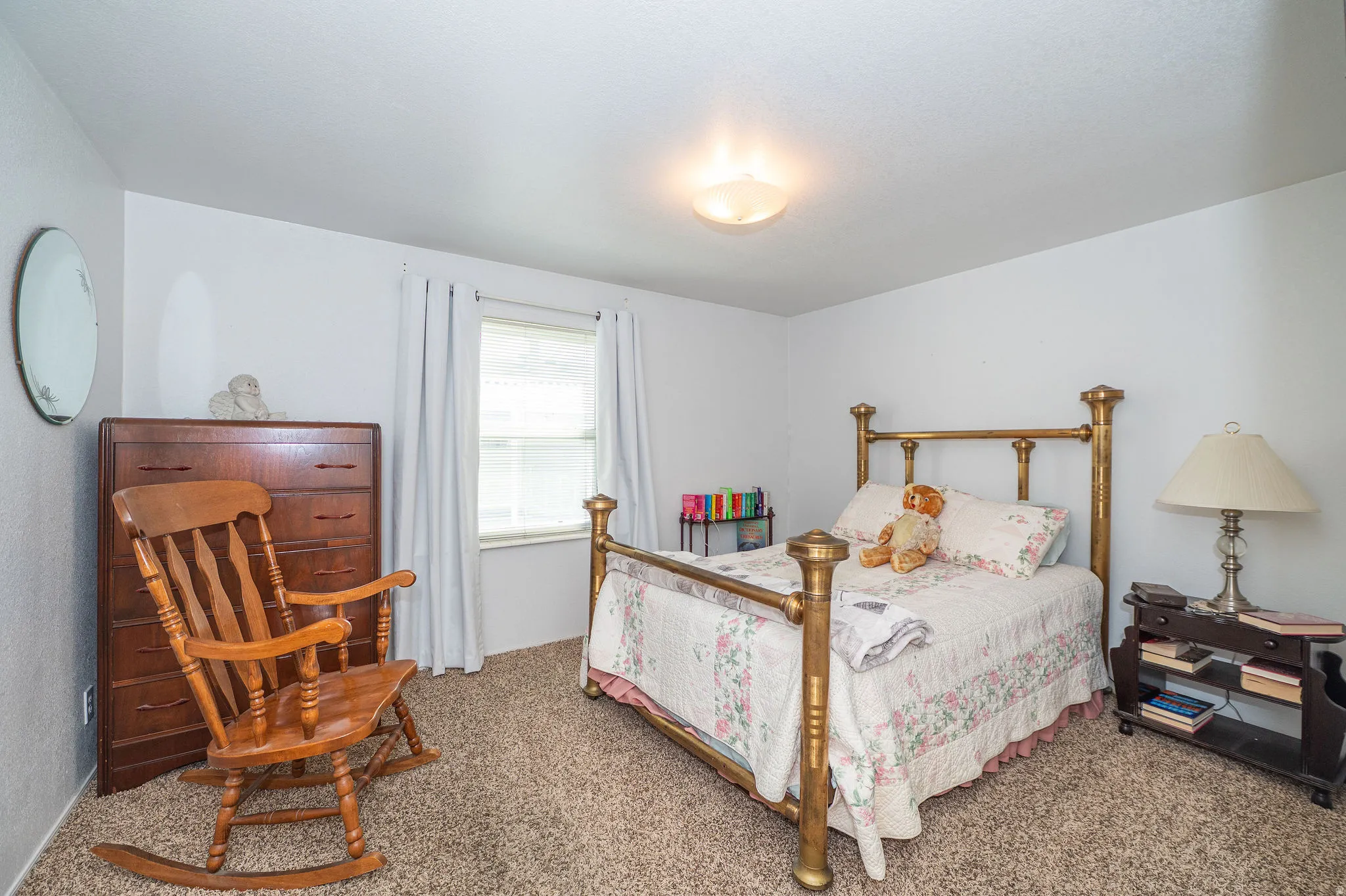 Wall-to-wall carpeting and a ceiling-mounted light fixture
