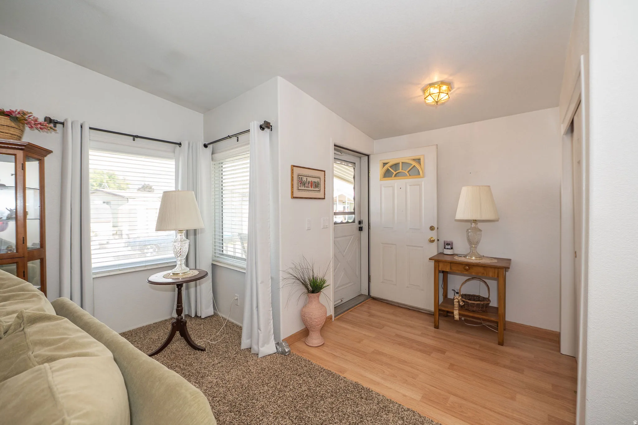 Entryway with wood-finish flooring and a ceiling-mounted light fixture