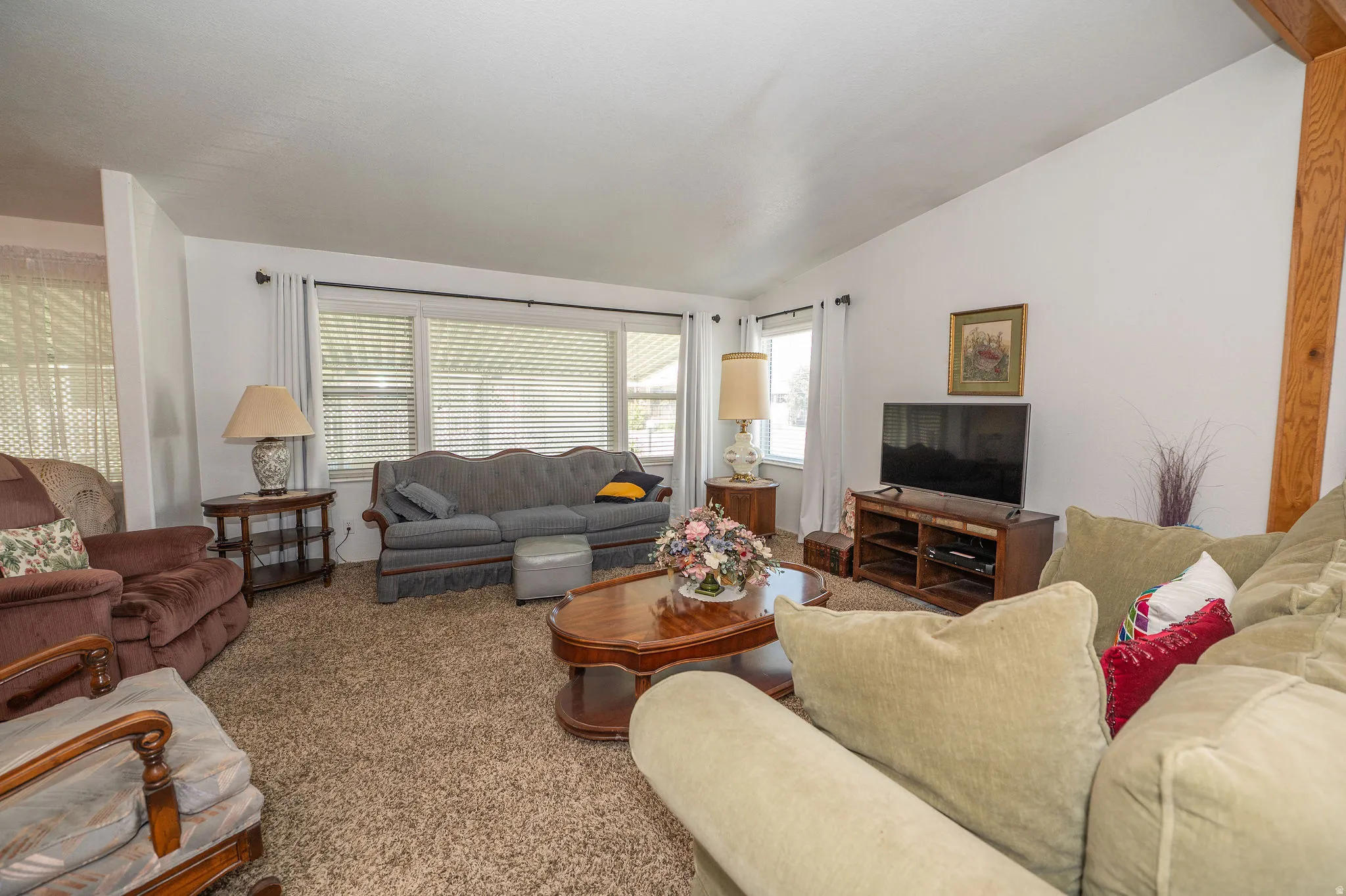 Vaulted ceiling with an exposed wood beam