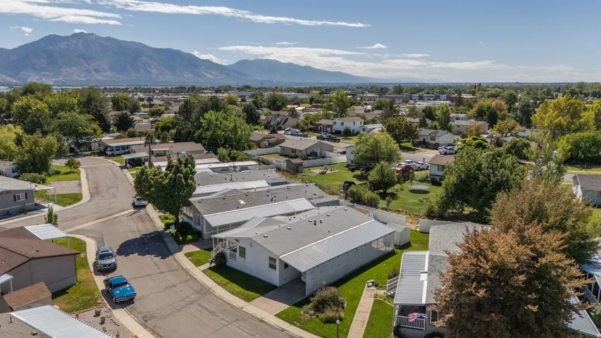 Residential community with mature landscaping and distant mountain scenery