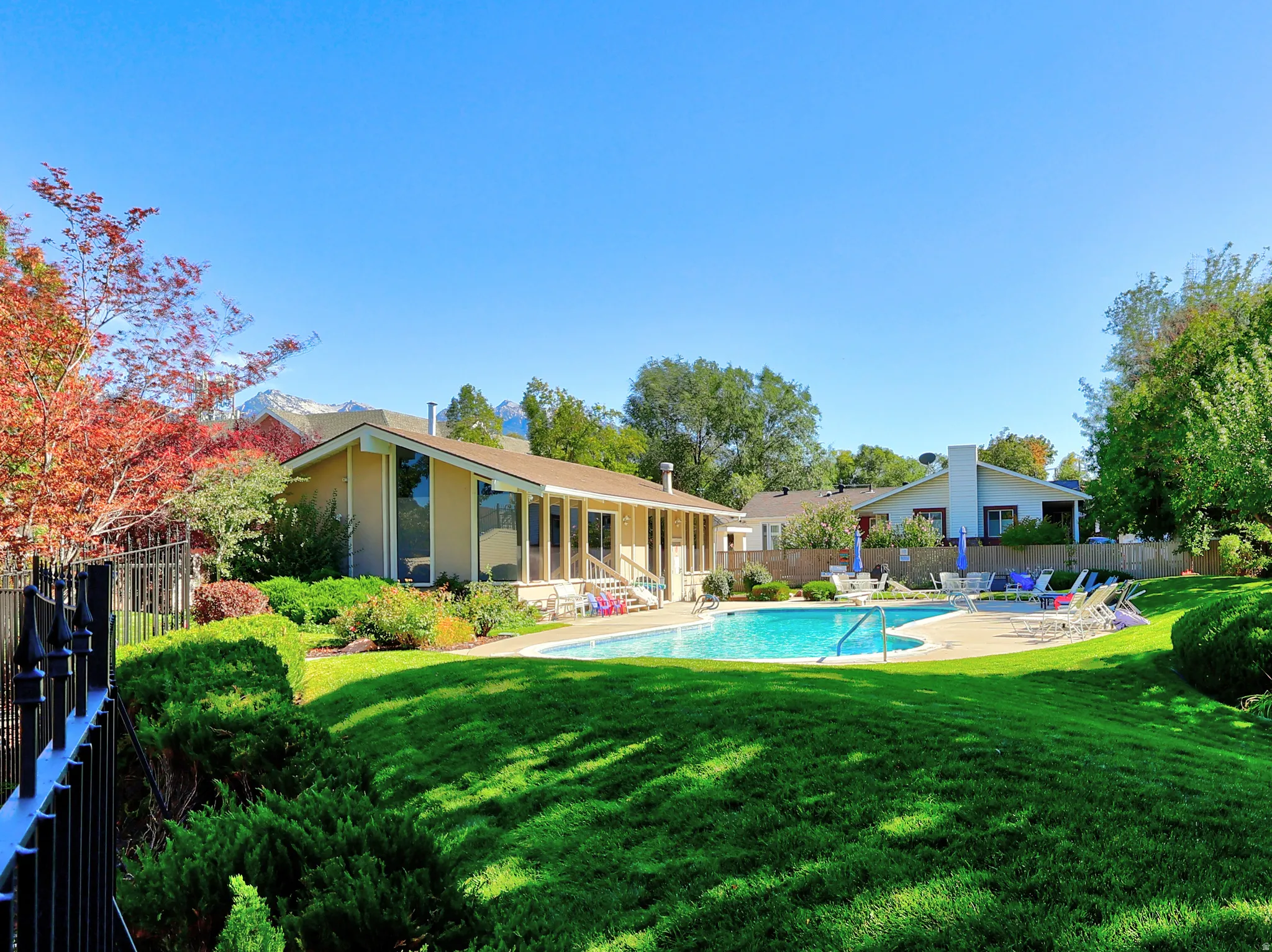 In-ground swimming pool with surrounding patio
