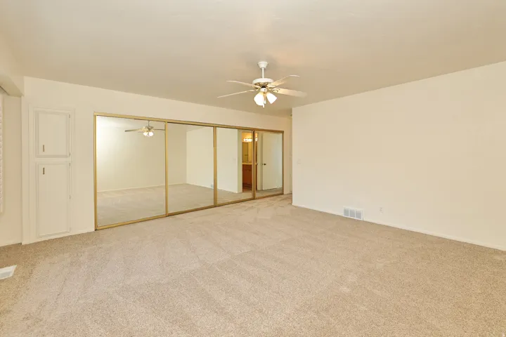 Wall-to-wall carpeting and neutral wall tones