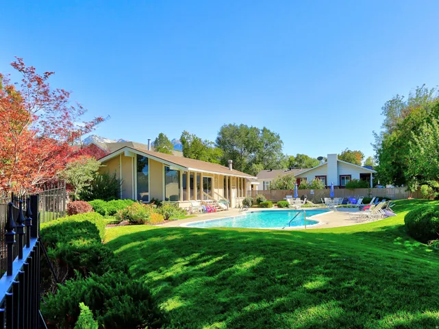 In-ground swimming pool with surrounding patio