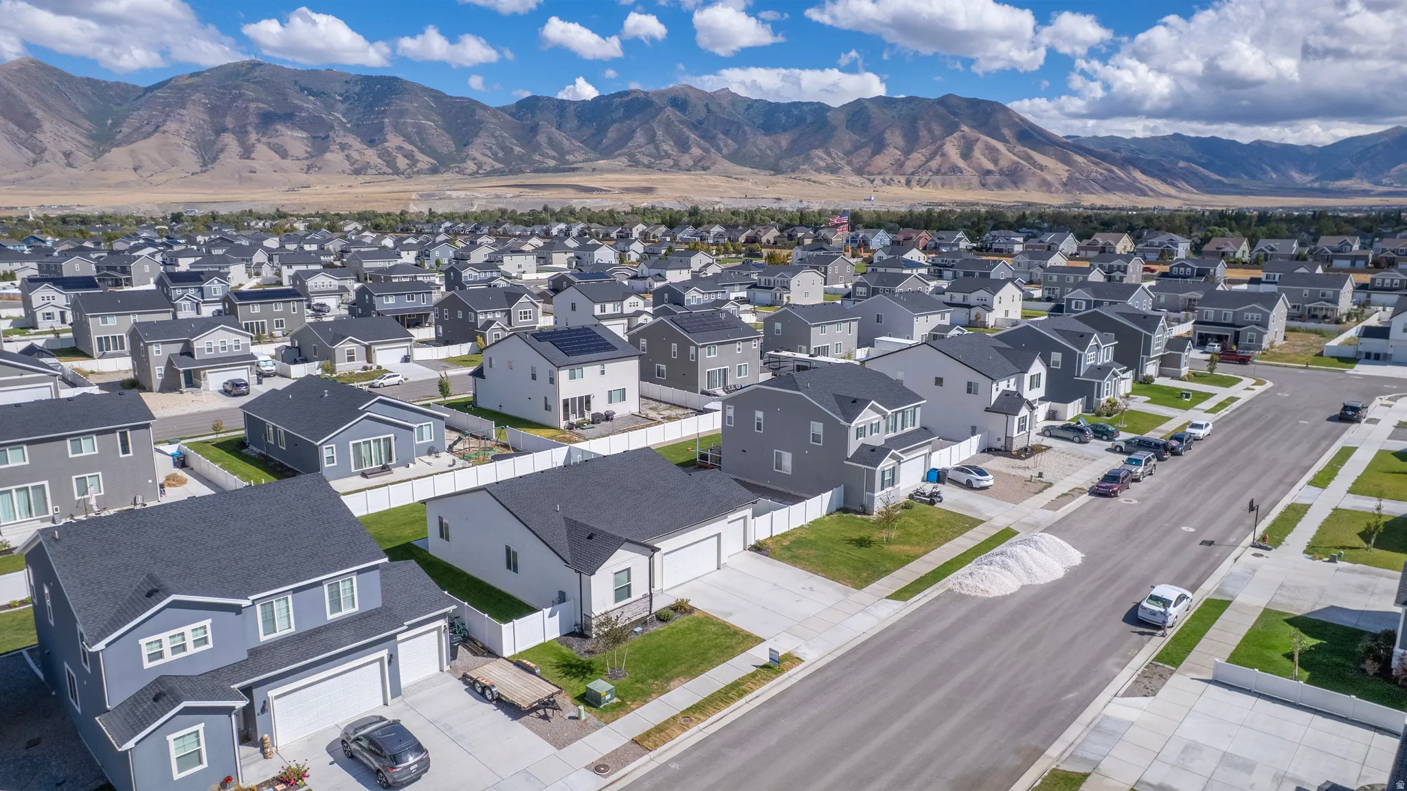 Residential neighborhood with established street infrastructure and mountain scenery