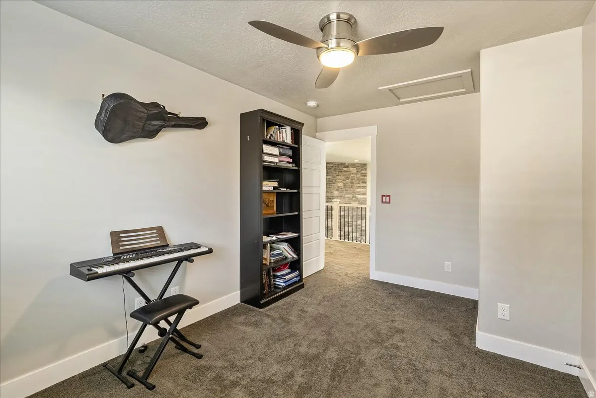 Recessed lighting, ceiling fan, and built-in shelving unit