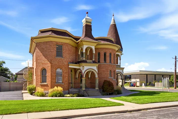Brick exterior with a conical turret and a spiral exterior staircase
