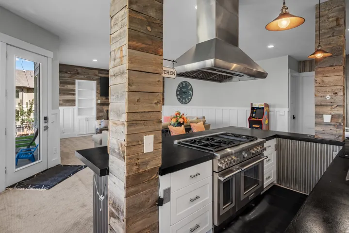 Stainless steel range with a professional-grade hood