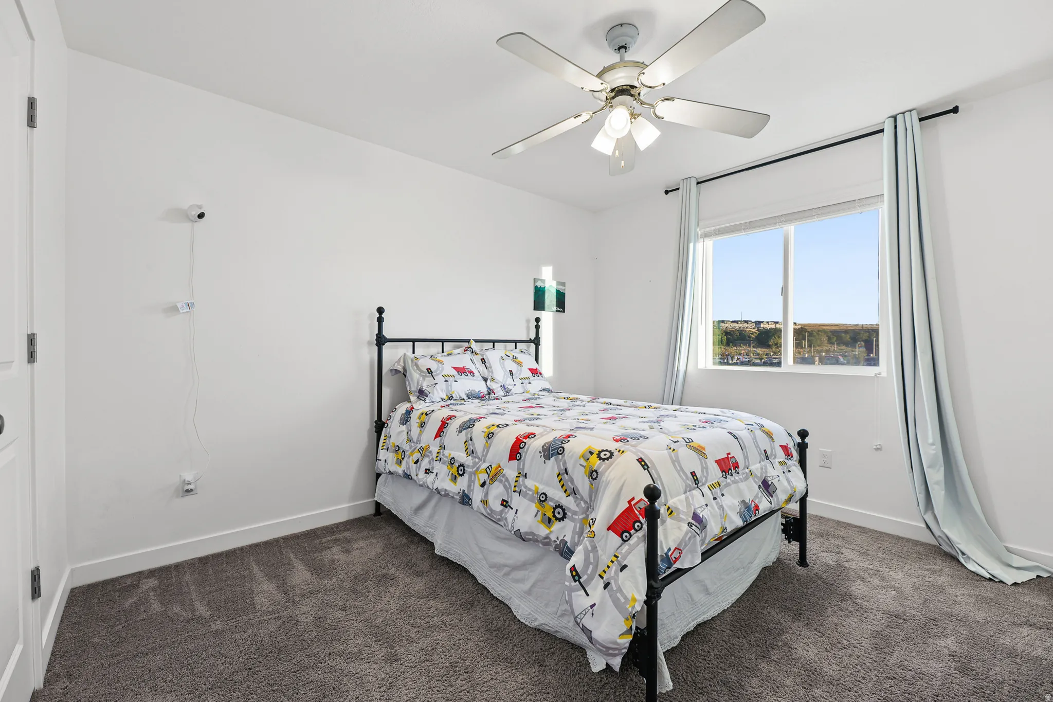 Recessed window with white blinds, wall-to-wall carpeting, and a ceiling fan with integrated lighting