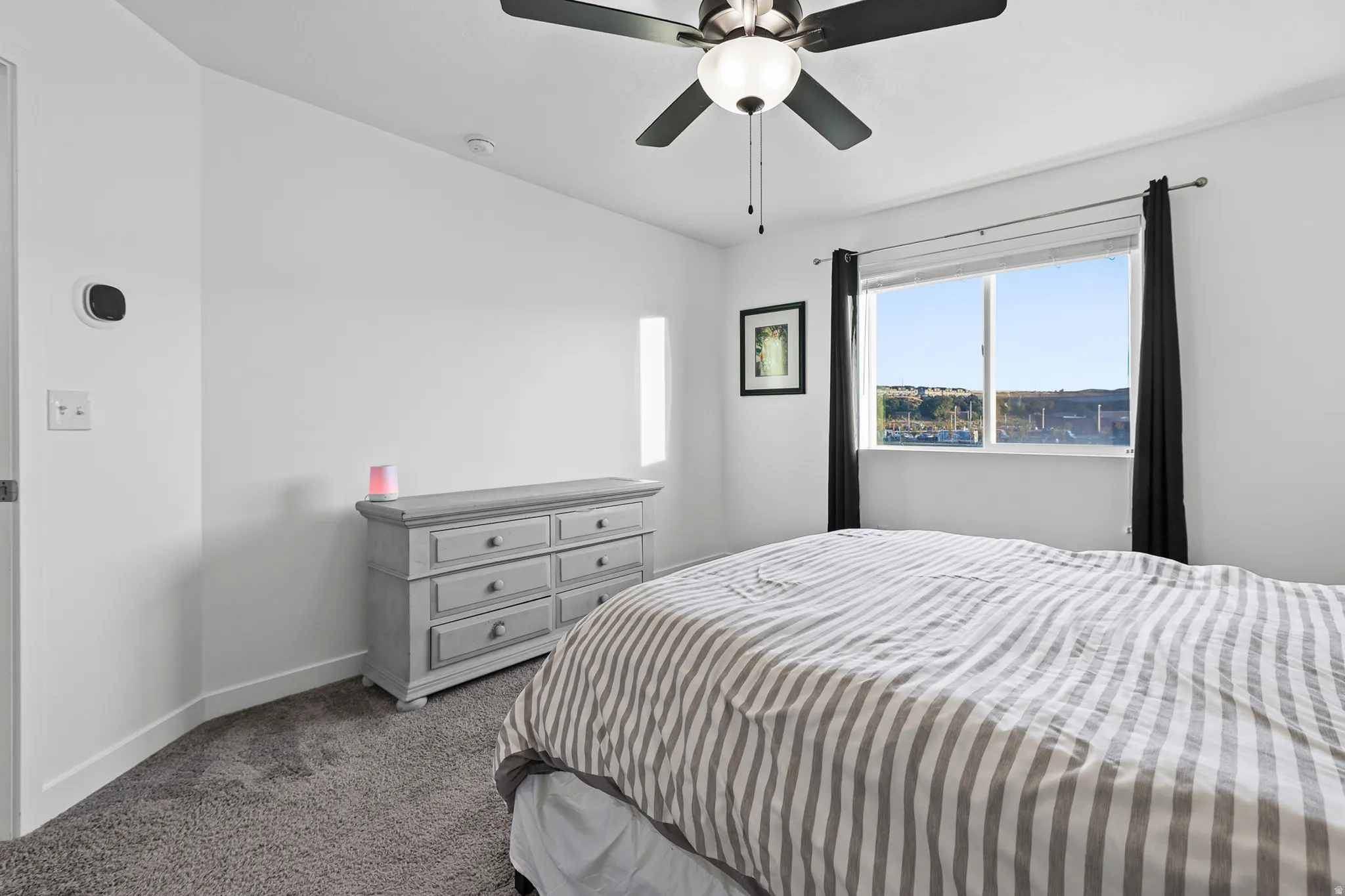 White painted walls with gray carpeting
