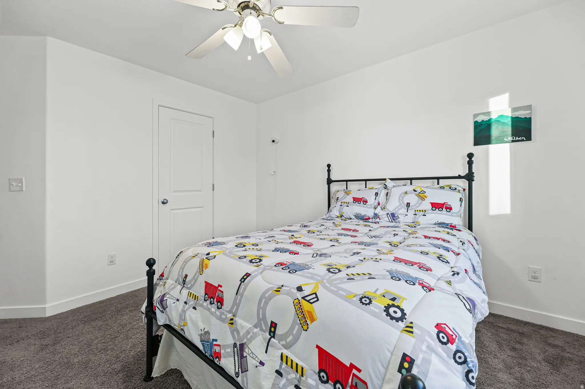 Recessed lighting, ceiling fan, white paneled door, and textured carpeting