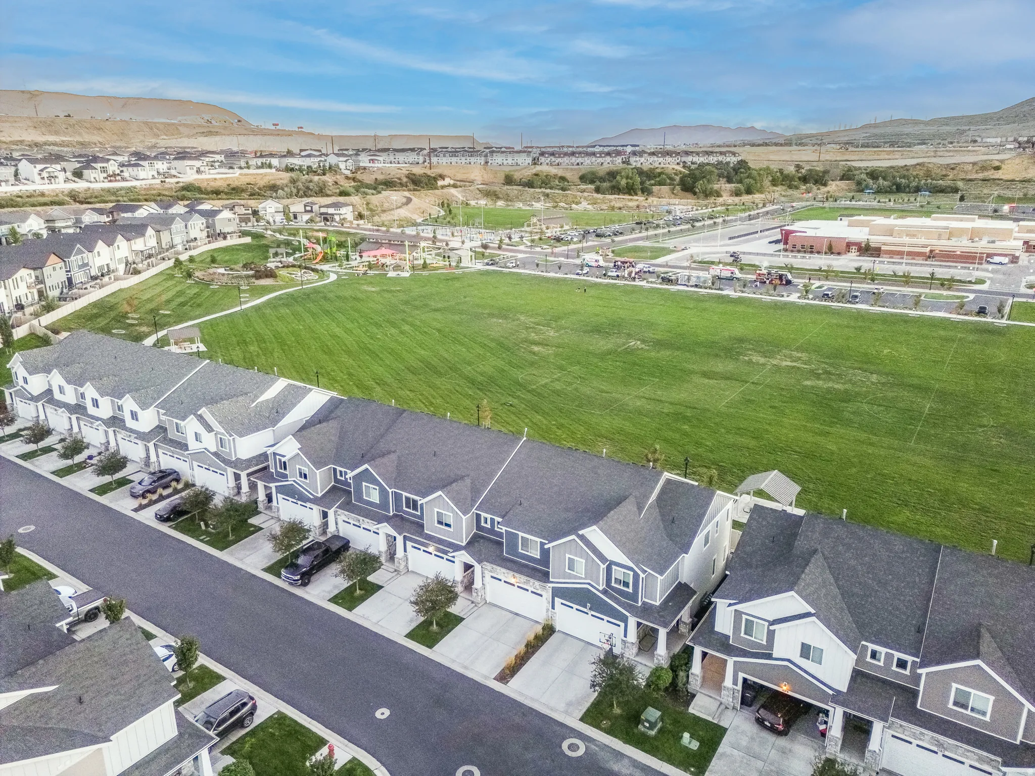 Modern townhomes featuring attached garages and private driveways