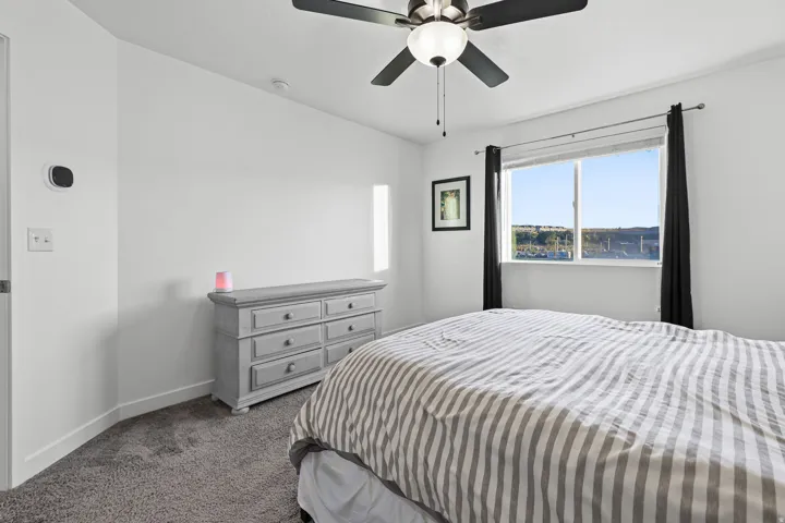 White painted walls with gray carpeting