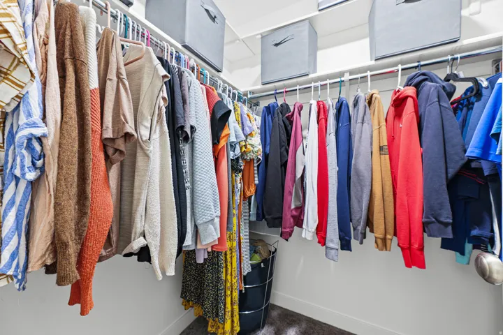 White shelving system with multiple hanging rods