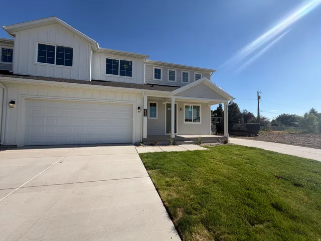 Contemporary exterior with white board and batten and light gray siding