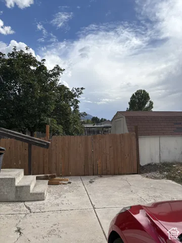 Fenced yard, with large shed