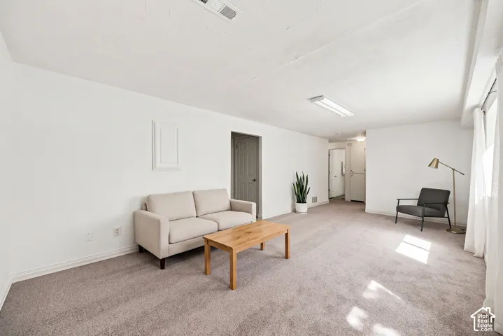 Spacious room featuring neutral carpeting and white painted walls,  Virtual display
