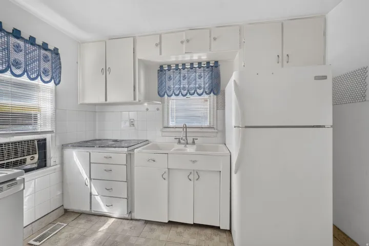 White cabinetry with matching appliances