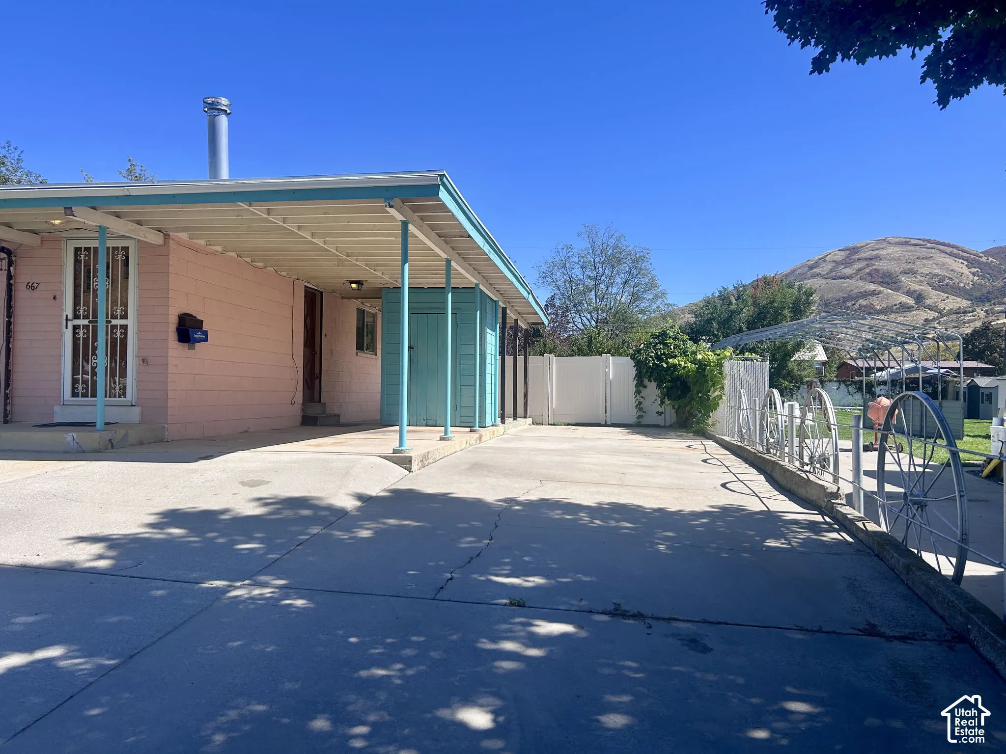 RV parking space and small shed at back of the carport