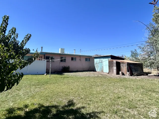 Large shed in the backyard with a cement floor plus a lean-to shed with lots of firewood for the wood-burning stove.