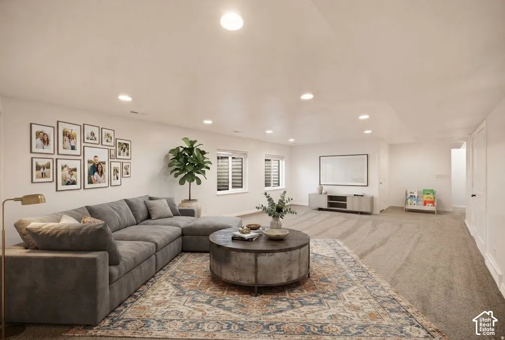 Recessed ceiling lighting, neutral wall finishes, and multiple windows with blinds