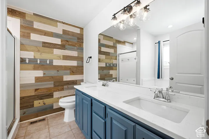 Dual vanity with undermount sinks and blue cabinetry
