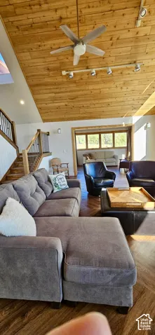 Vaulted wood-paneled ceiling with a ceiling fan, recessed lighting, and track lighting