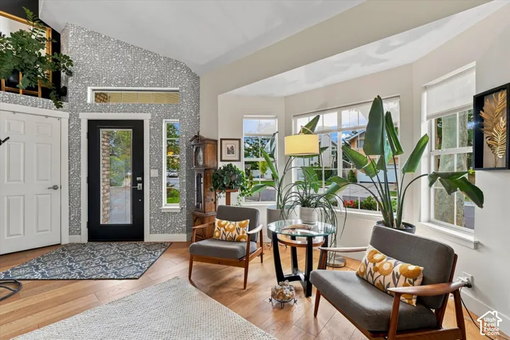 Vaulted entry with decorative accent wall
