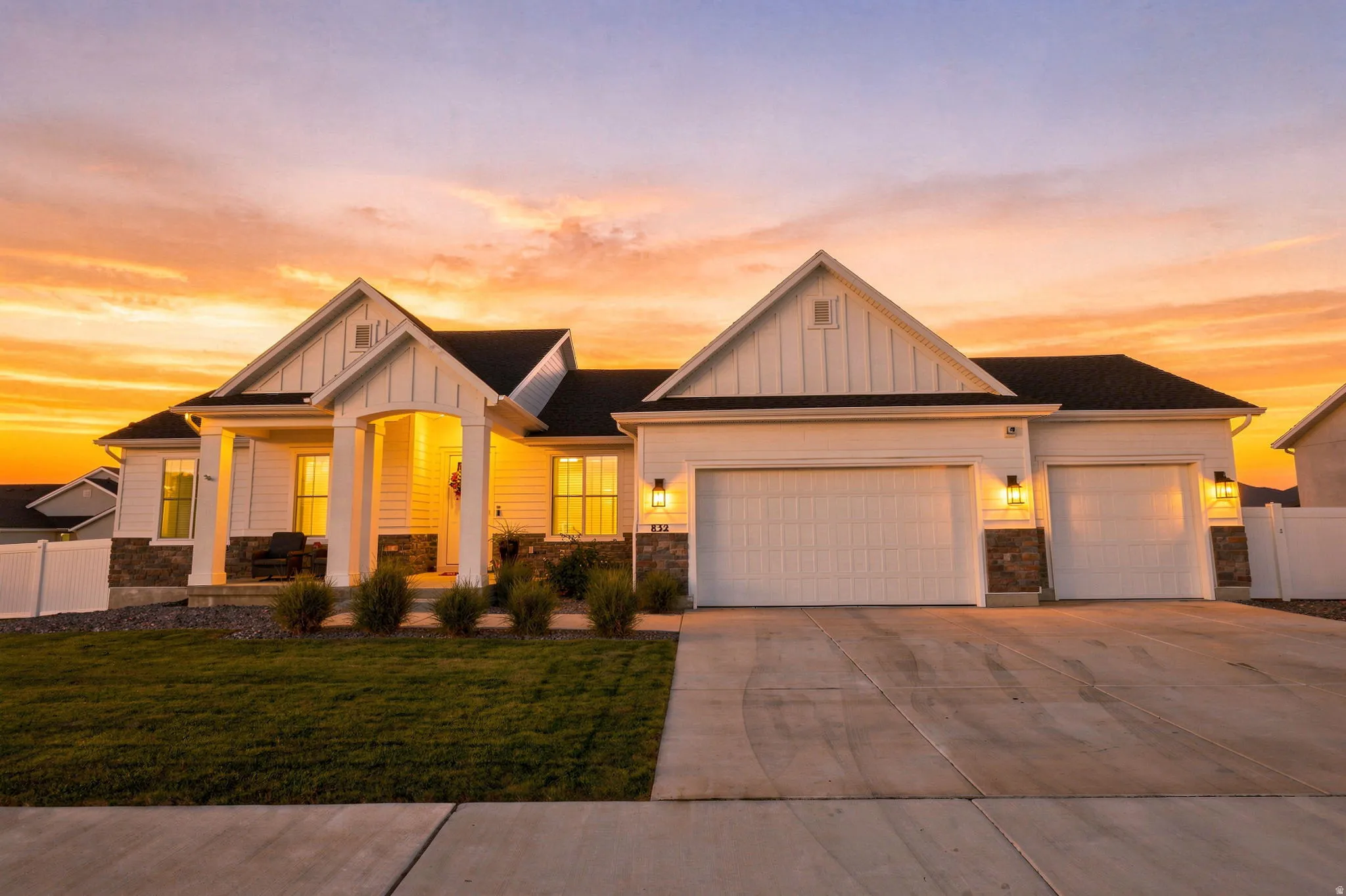 White siding exterior with black shingle roof
