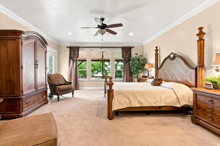 Recessed lighting, crown molding, a ceiling fan, and multiple windows